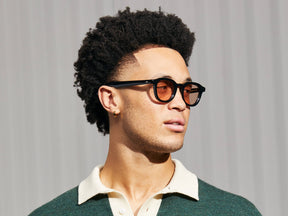 Model is wearing The DAHVEN in Black in size 47 with New York Rose Tinted Lenses