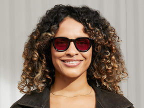 Model is wearing The DAHVEN in Black in size 47 with Purple Nurple Tinted Lenses