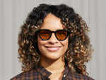 Model is wearing The DAHVEN in Black in size 47 with Amber Tinted Lenses