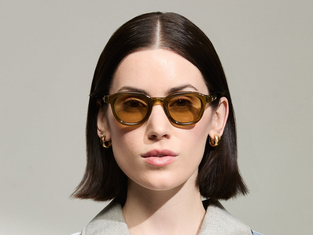 Model is wearing The DAHVEN in Olive Brown in size 44 with Amber Tinted Lenses