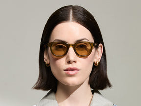 Model is wearing The DAHVEN in Olive Brown in size 44 with Amber Tinted Lenses