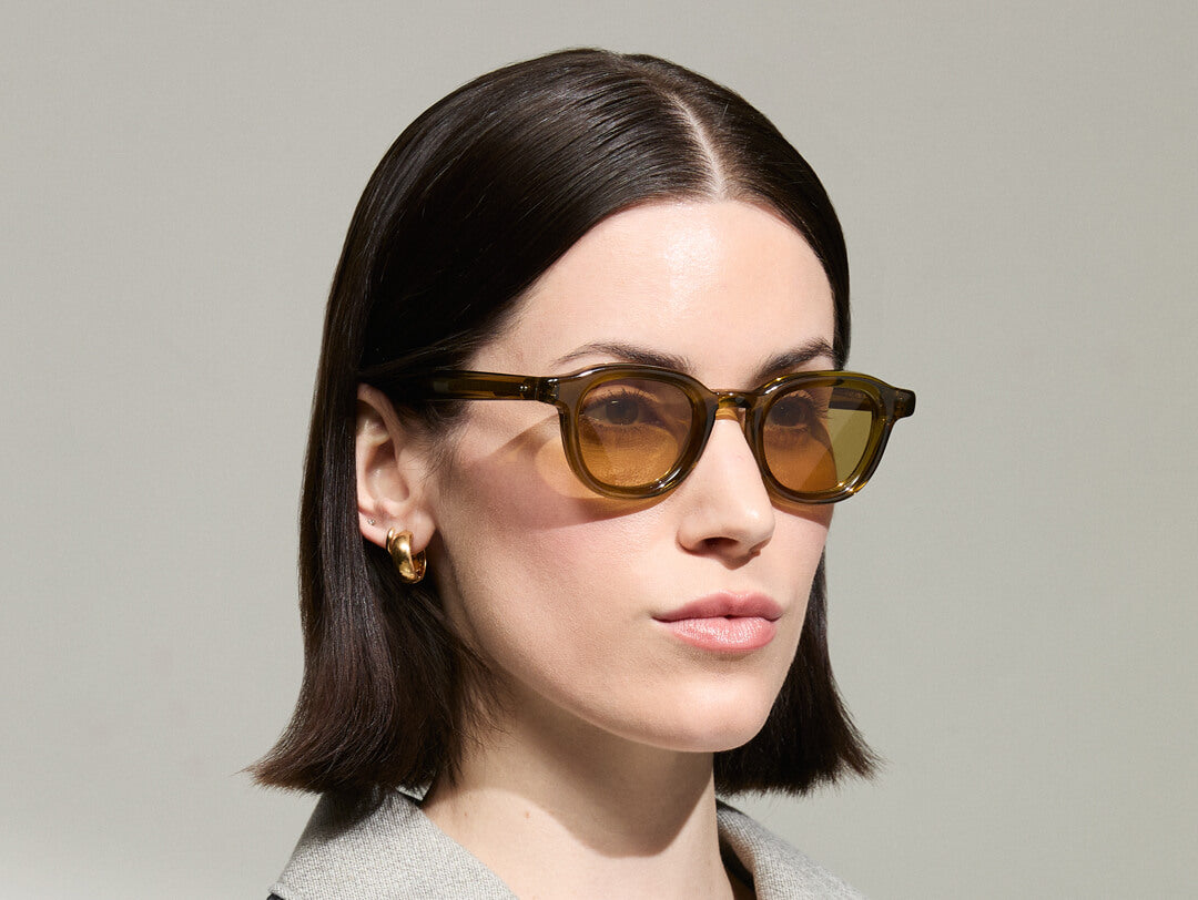 Model is wearing The DAHVEN in Olive Brown in size 44 with Amber Tinted Lenses
