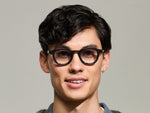 Model is wearing The DAHVEN in Grey in size 44 with American Grey Fade Tinted Lenses