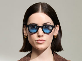 Model is wearing The DAHVEN in Navy in size 44 with Celebrity Blue Tinted Lenses