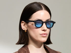 Model is wearing The DAHVEN in Navy in size 44 with Celebrity Blue Tinted Lenses