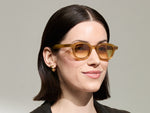 Model is wearing The DAHVEN in Blonde in size 44 with Chestnut Fade Tinted Lenses