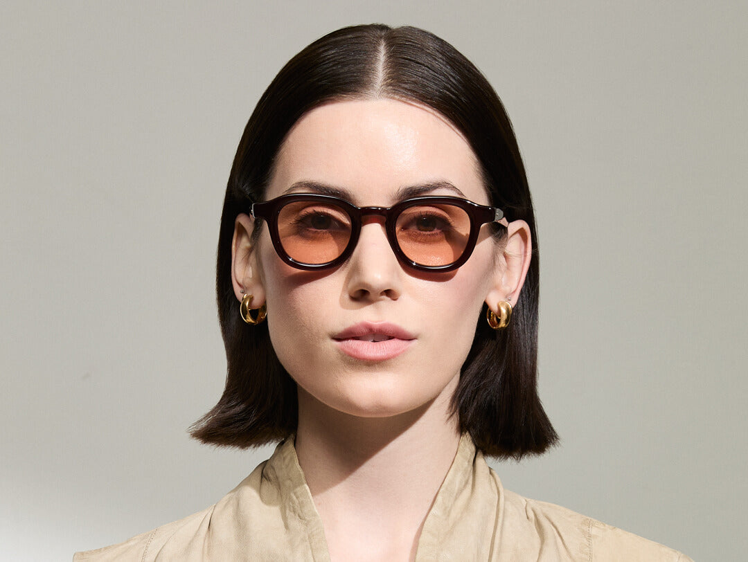 Model is wearing The DAHVEN in Burgundy in size 44 with New York Rose Tinted Lenses