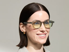 Model is wearing The DAHVEN in Sage in size 47 with Limelight Tinted Lenses