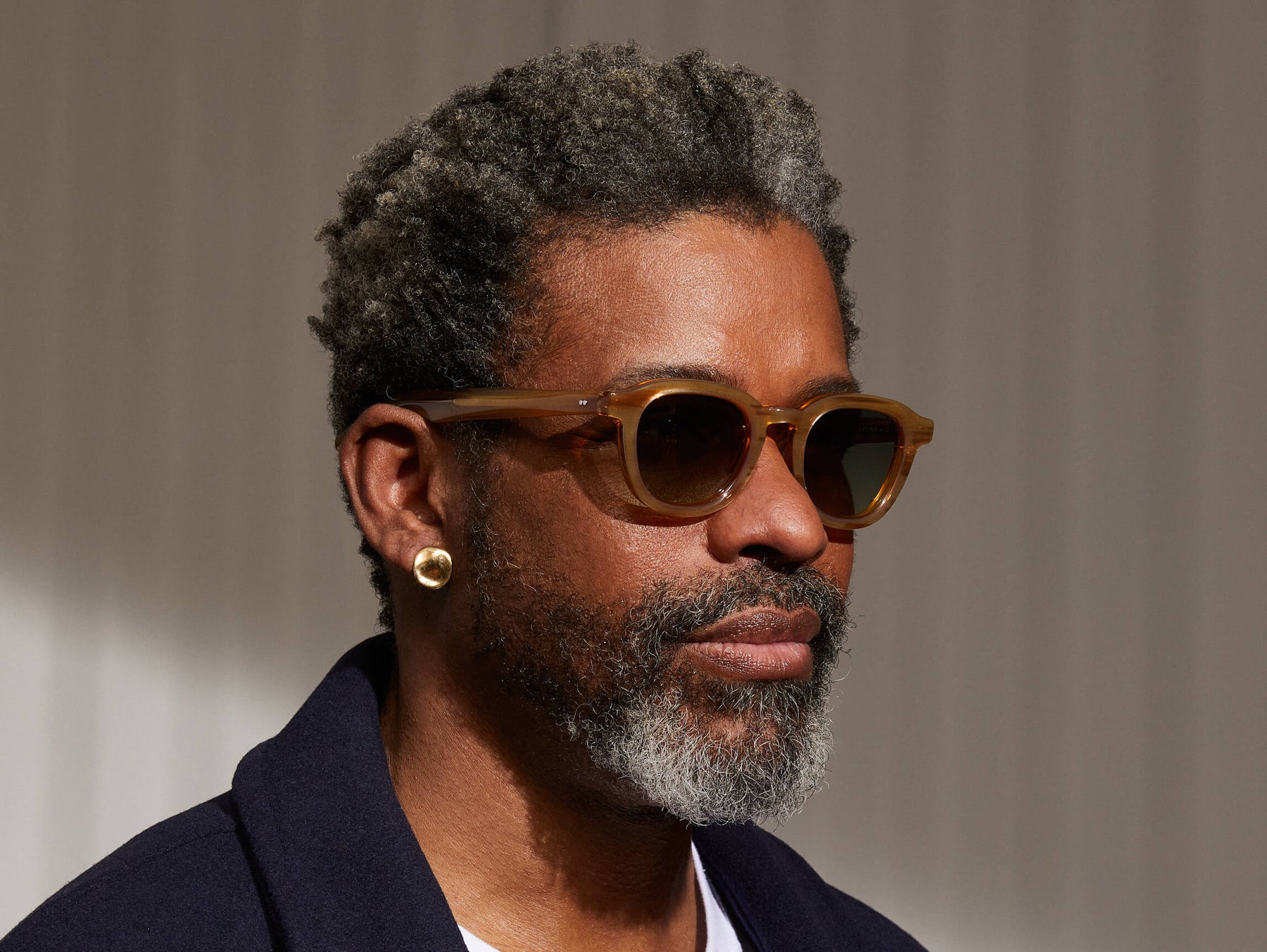 Model is wearing The DAHVEN SUN in Blonde in size 47 with Forest Wood Tinted Lenses