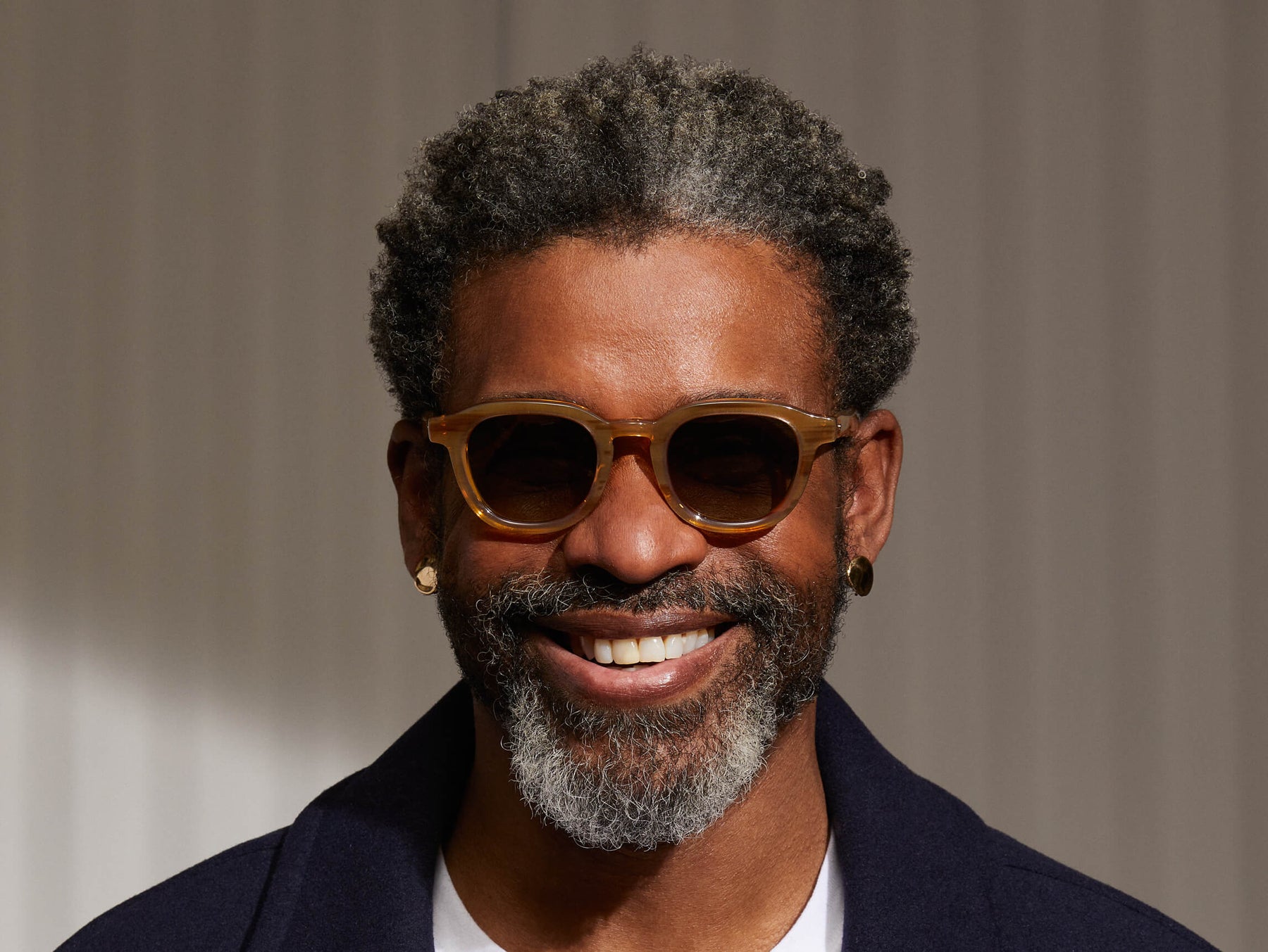 Model is wearing The DAHVEN SUN in Blonde in size 47 with Forest Wood Tinted Lenses