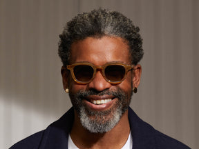 Model is wearing The DAHVEN SUN in Blonde in size 47 with Forest Wood Tinted Lenses