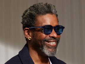 Model is wearing The DAHVEN SUN in Sapphire in size 47 with Celebrity Blue Tinted Lenses