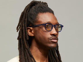 Model is wearing The DAHVEN in Navy size 44 with AMBER+ Tinted Lenses