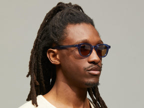 Model is wearing The DAHVEN in Navy size 44 with AMBER+ Tinted Lenses