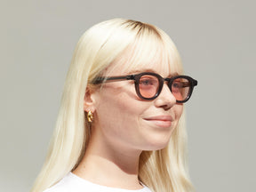 Model is wearing The DAHVEN in Grey size 44 with ROSE+ Tinted Lenses