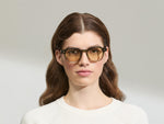 Model is wearing The DOLT in Khaki in size 49 with AMBER+ Lenses
