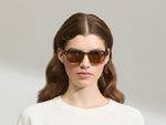 Model is wearing The DOLT in Khaki in size 49 with AMBER+ Lenses