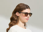 Model is wearing The DOLT in Khaki in size 49 with AMBER+ Lenses