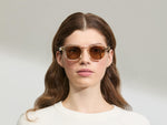 Model is wearing The DOLT in Flesh/Tortoise in size 49 with AMBER+ Lenses