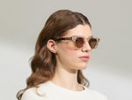 Model is wearing The DOLT in Flesh/Tortoise in size 49 with AMBER+ Lenses