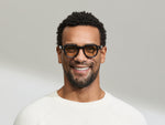 Model is wearing The DOLT in Navy in size 46 with AMBER+ Lenses