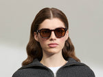 Model is wearing The DOLT in Burgundy in size 49 with AMBER+ Lenses