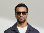 Model is wearing The DOLT in Dark Green in size 46 with AMBER+ Lenses