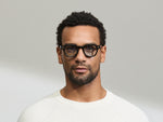 Model is wearing The DOLT in Black in size 46 with BLUE+ Lenses