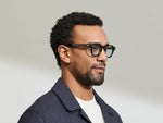 Model is wearing The DOLT in Dark Green in size 46 with BLUE+ Lenses