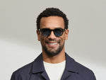 Model is wearing The DOLT in Dark Green in size 46 with BLUE+ Lenses