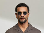 Model is wearing The DOLT in Flesh/Tortoise in size 46 with BLUE+ Lenses