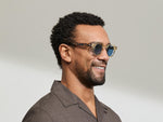 Model is wearing The DOLT in Flesh/Tortoise in size 46 with BLUE+ Lenses