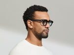 Model is wearing The DOLT in Black in size 46 with BLUE+ Lenses