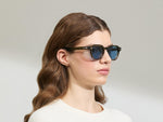 Model is wearing The DOLT in Khaki in size 49 with BLUE+ Lenses