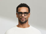 Model is wearing The DOLT in Navy in size 46 with BLUE+ Lenses