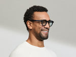 Model is wearing The DOLT in Navy in size 46 with BLUE+ Lenses