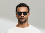 Model is wearing The DOLT in Black in size 46 with BLUE+ Lenses