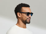 Model is wearing The DOLT in Black in size 46 with BLUE+ Lenses