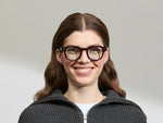 Model is wearing The DOLT in Burgundy in size 49 with BLUE+ Lenses