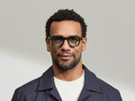 Model is wearing The DOLT in Dark Green in size 46 with BLUE+ Lenses