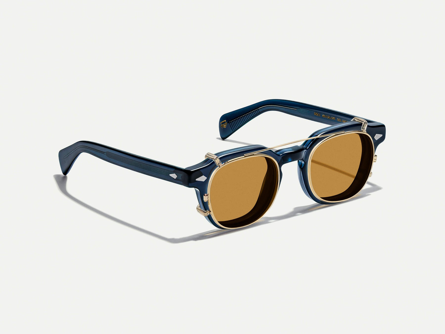The DOLT CLIP in Gold with Amber Tinted Lenses