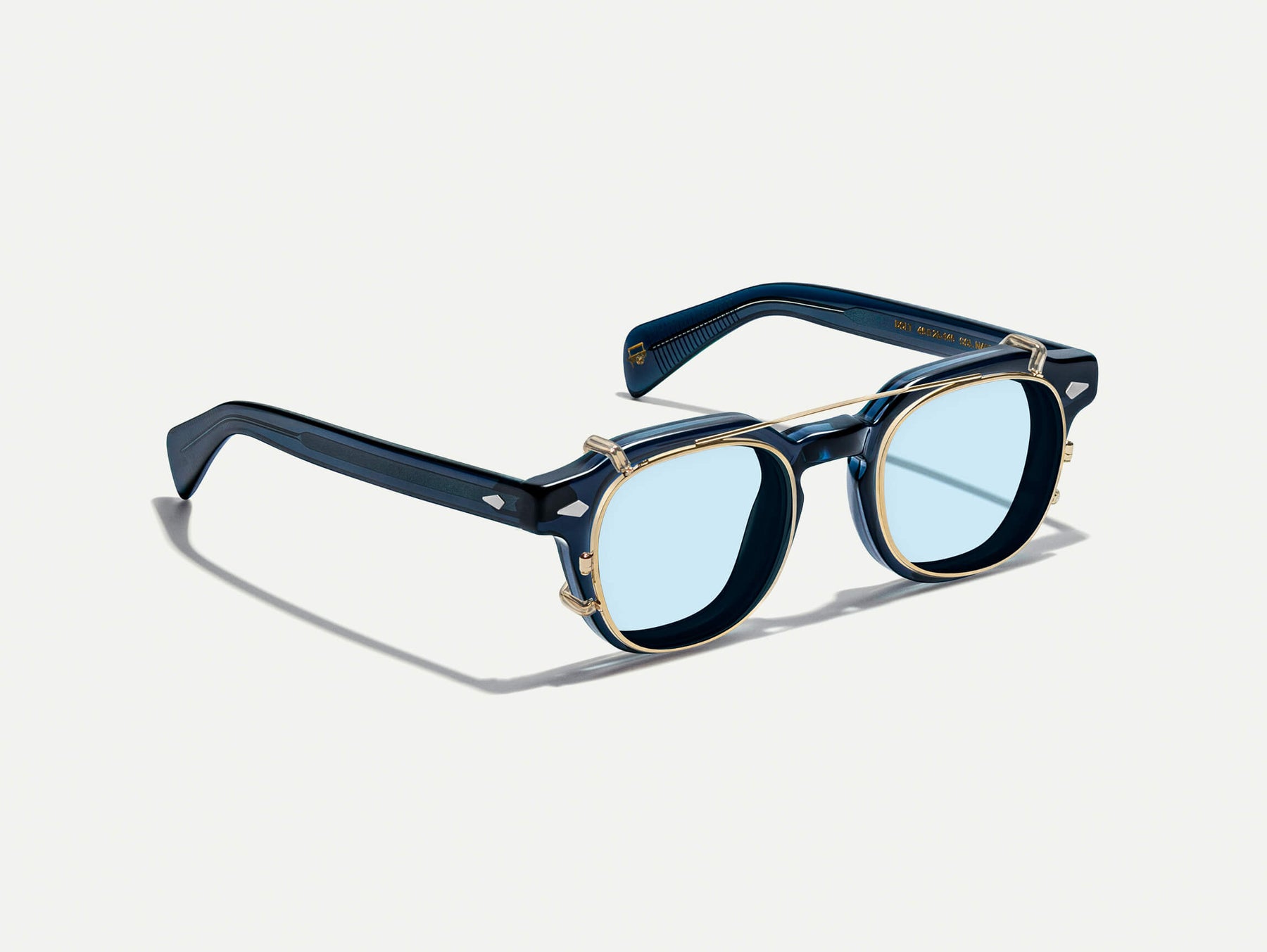 The DOLT CLIP in Gold with Bel Air Blue Tinted Lenses