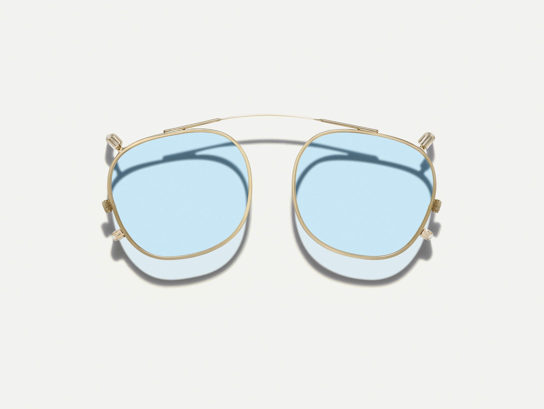 The DOLT CLIP in Gold with Bel Air Blue Tinted Lenses