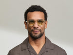 Model is wearing The DOLT in Flesh/Tortoise in size 46 with GREEN+ Lenses