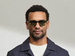 Model is wearing The DOLT in Grey-Brown Fade in size 46 with GREEN+ Lenses