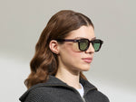 Model is wearing The DOLT in Burgundy in size 49 with GREEN+ Lenses