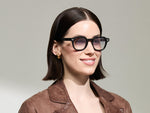 The Model is wearing The DOLT in Black in size 46 with American Grey Fade Tinted Lenses