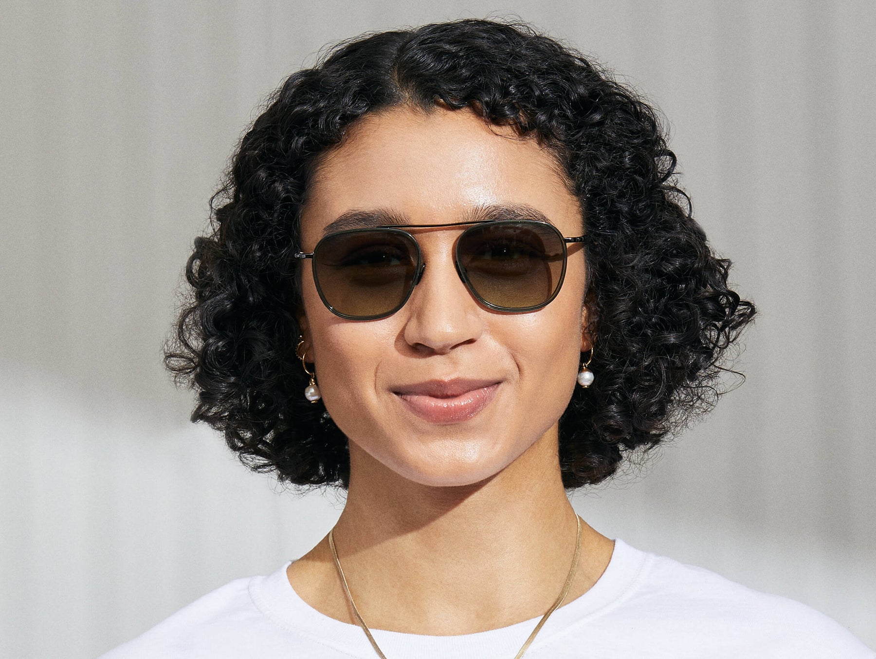 Model is wearing The FANAGLE SUN in Pine in size 53 with Forest Wood Tinted Lenses