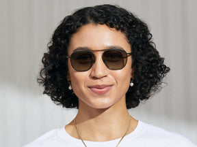 Model is wearing The FANAGLE SUN in Pine in size 53 with Forest Wood Tinted Lenses