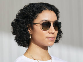 Model is wearing The FANAGLE SUN in Pine in size 53 with Forest Wood Tinted Lenses